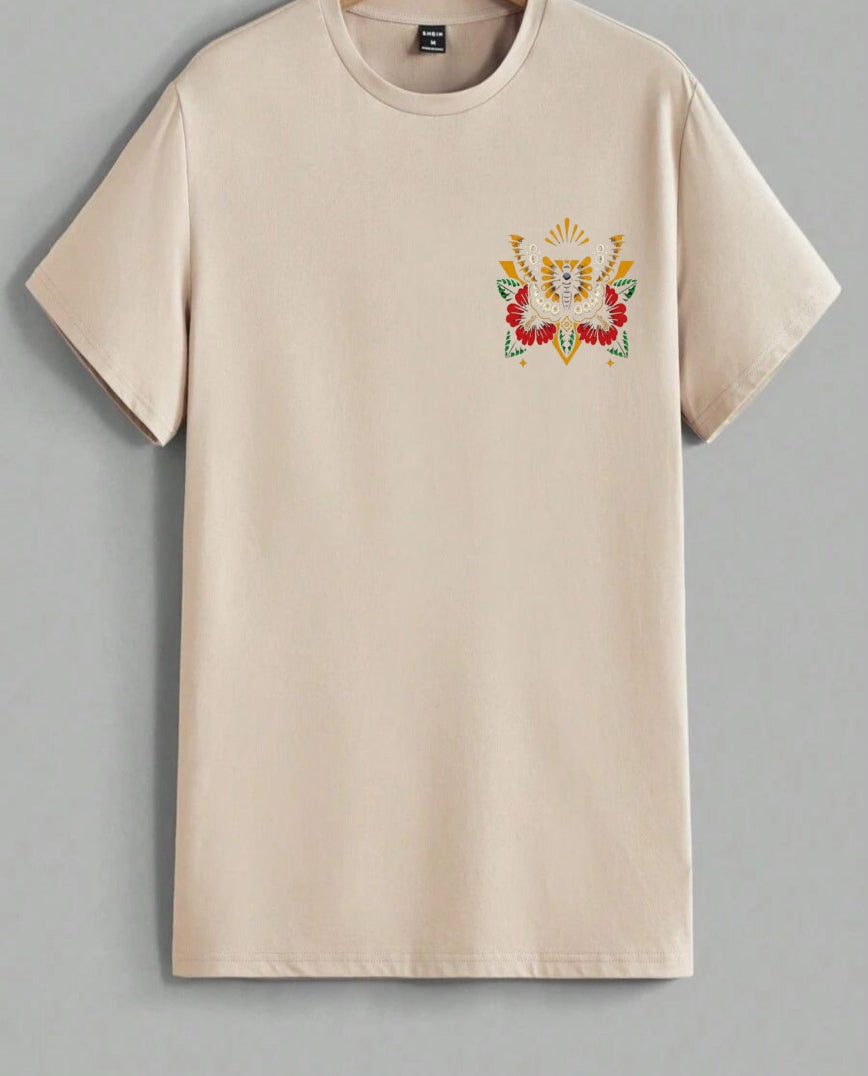 Beige t-shirt with a colorful embroidered design on a gray background