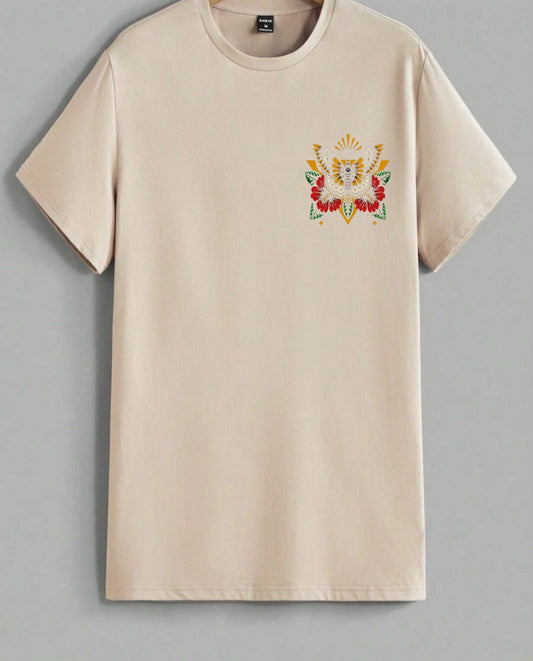 Beige t-shirt with a colorful embroidered design on a gray background